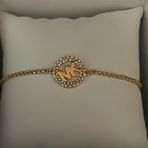 Michael Kors gold pave slider bracelet.